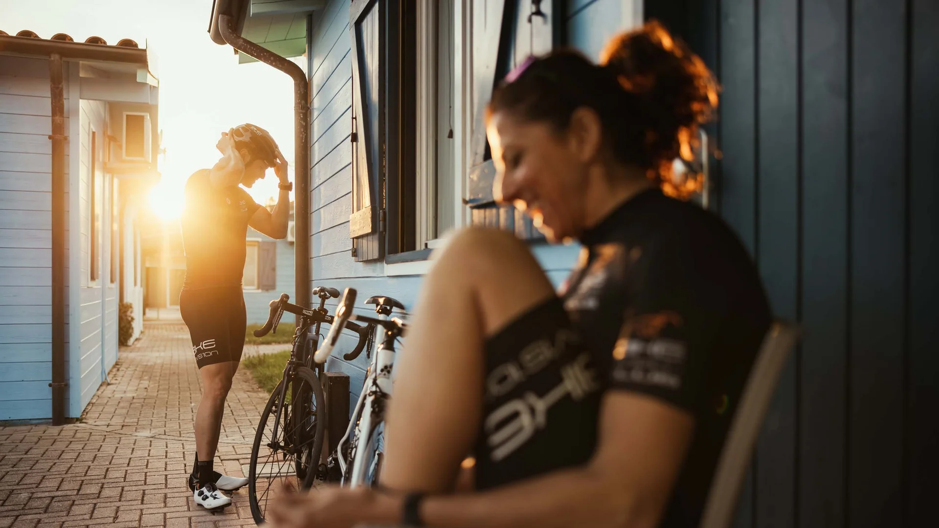 Sport & more at Natural Village Resort Cyclists in sportswear near bikes at sunrise